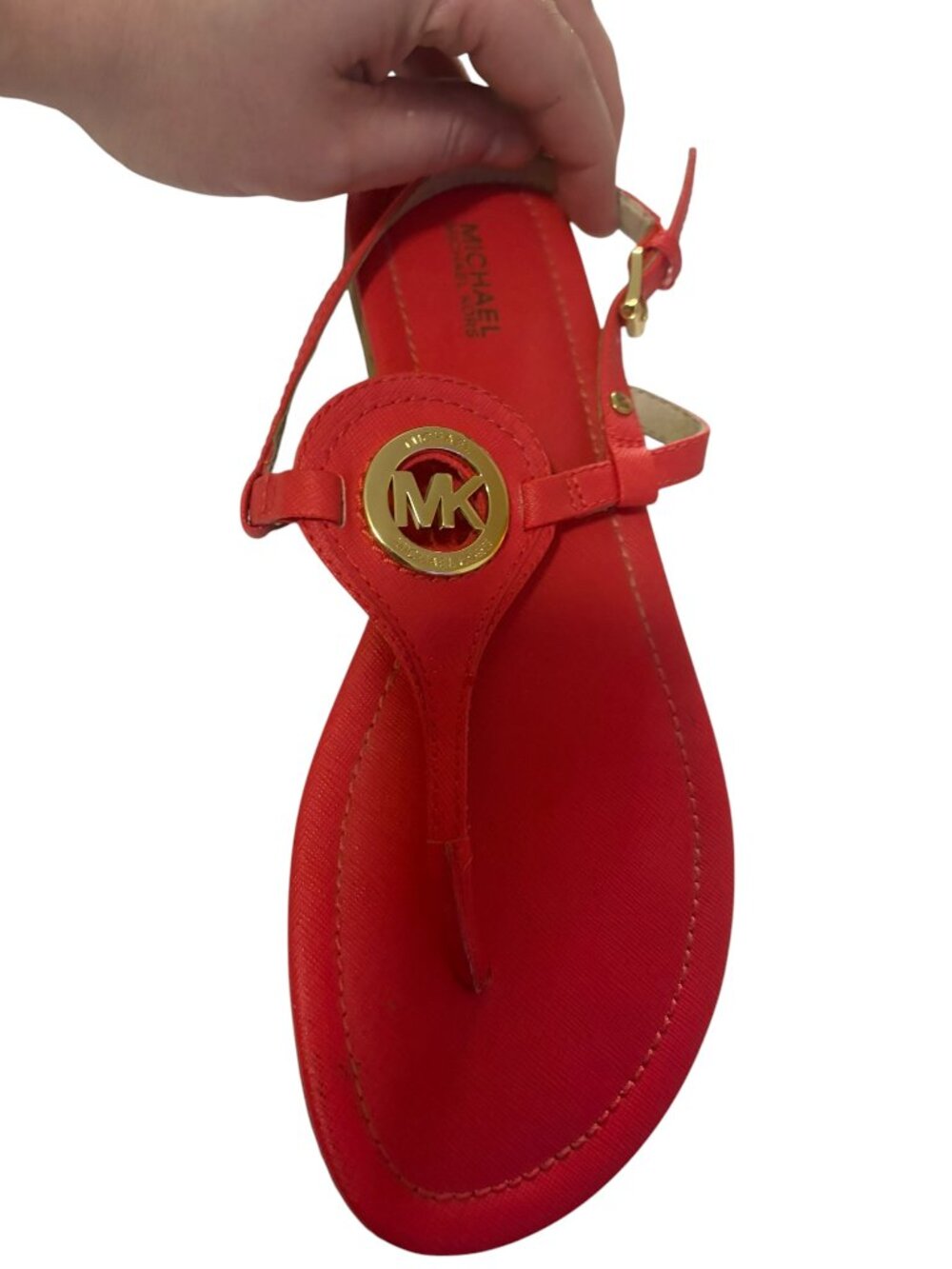 Michael Michael Kors Capri thong sandals in coral reef, featuring a gold MK logo